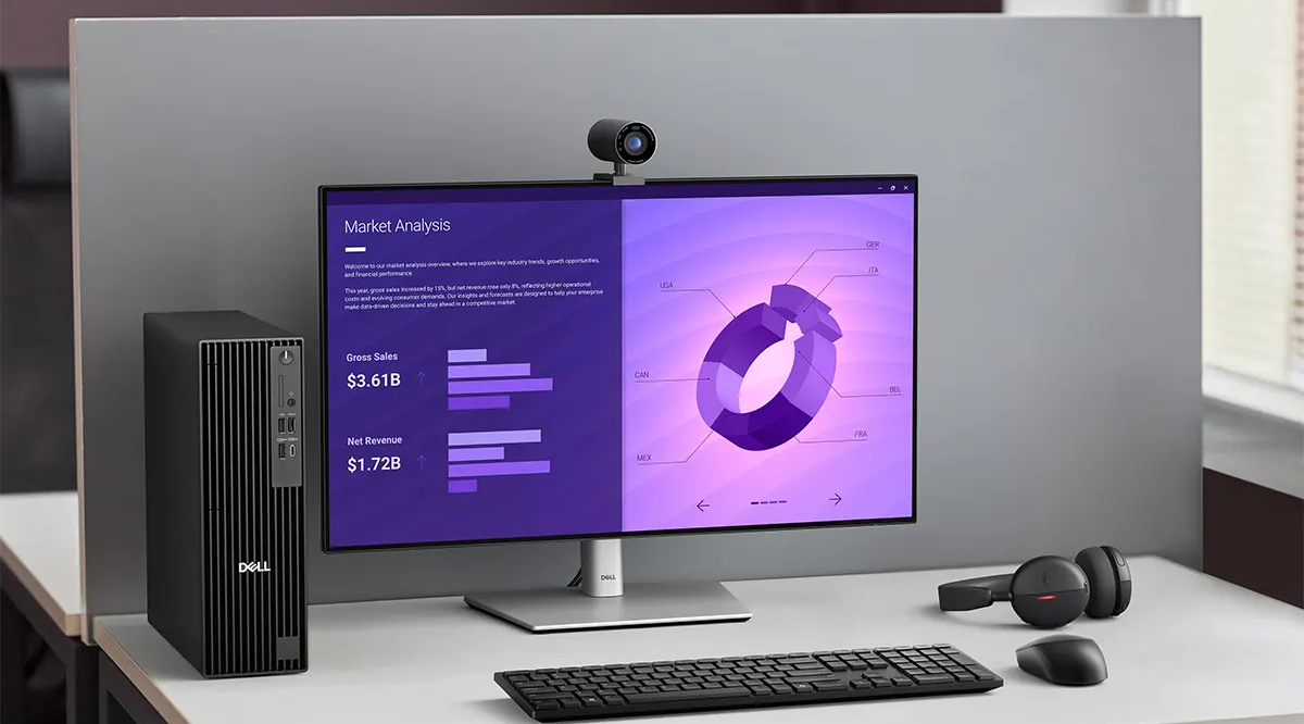 Dell corporate desktop with monitor, keyboard, and mouse on office desk